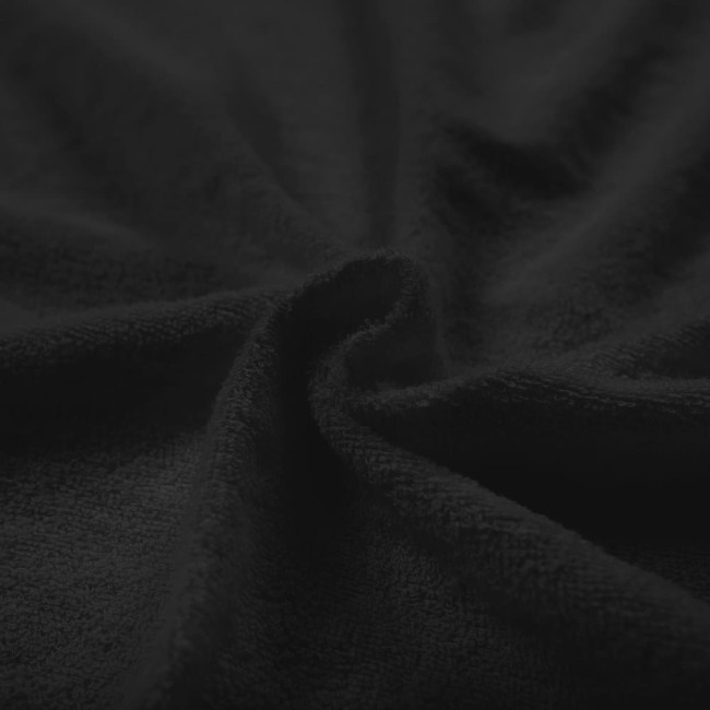 Pościel frotte 160x200 w kolorze czarnym, z widoczną, miękką i teksturowaną powierzchnią, leżąca na płasko. Zdjęcie ukazuje zbliżenie na fakturę materiału, podkreślając jego jednolity kolor i komfortowy wygląd.