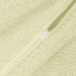 Pościel frotte 160x200 w kolorze kremowym, widoczny suwak z białą końcówką, faktura materiału z miękkim, puszystym wykończeniem, rozłożona na płaskiej powierzchni. Idealna do aranżacji sypialni.