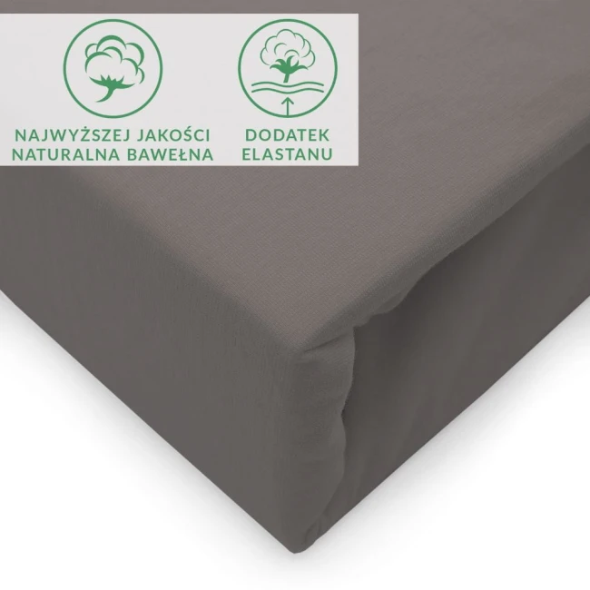 Prześcieradło jersey z elastanem w kolorze antracyt, rozmiar 160x200, leżące na białym tle. Wygodna, elastyczna tkanina z naturalnej bawełny, z widocznymi etykietami wskazującymi jej właściwości. Brak dodatkowych elementów dekoracyjnych.