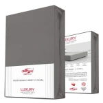 Prześcieradło jersey z elastanem w kolorze antracytowym, rozmiar 180x200 cm, z gumką. Widoczne opakowanie z logo DARYmex oraz informacjami o produkcie. Prześcieradło leży w pozycji pionowej.