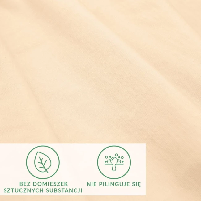 Prześcieradło jersey z elastanem o wymiarach 200x220 cm w kolorze beżowym, w leżącej pozycji. Widoczna tekstura materiału, na której umieszczono czytelne ikony informacyjne dotyczące właściwości produktu. Tło zdjęcia jest neutralne.