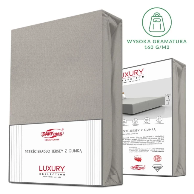 Prześcieradło jersey z elastanem w kolorze popielatym, z gumką, w rozmiarze 200x220 cm, leżące w opakowaniu. Widoczna etykieta z informacjami o producencie oraz grafika przedstawiająca zastosowanie na materacu. Tło białe.