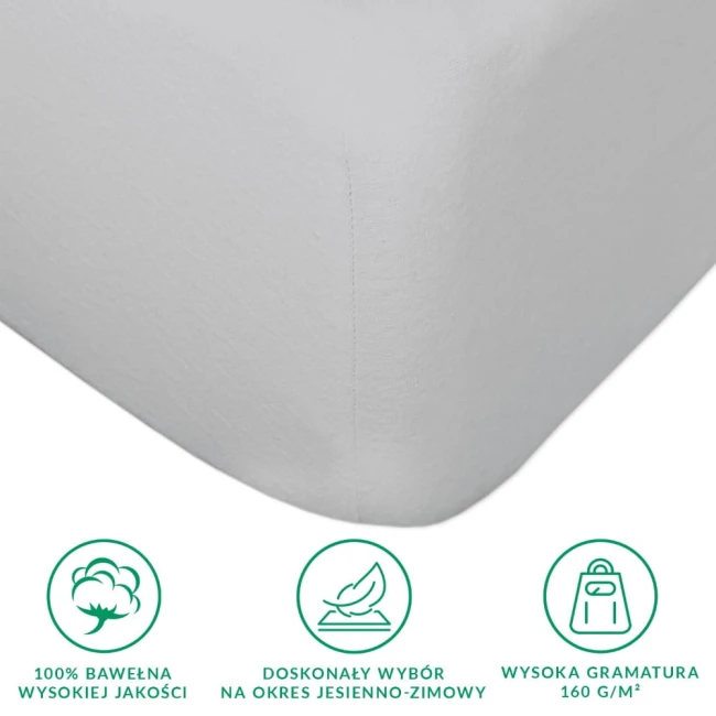 Prześcieradło flanelowe z gumką 140x200 w jasnoszarym kolorze, wykonane z 100% bawełny o wysokiej gramaturze 160 g/m², widoczne z boku w zbliżeniu. Wyróżnia się delikatną fakturą i mocnymi brzegami, idealne na sezon jesienno-zimowy.