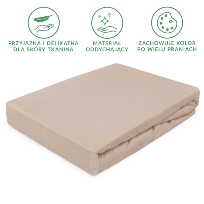 Prześcieradło jersey z gumką 160x200 w kolorze beżowym, leżące na płaskiej powierzchni. Materiał gładki, elastyczny, odporne na zagniecenia. Brzeg z gumką zapewniający stabilne mocowanie na materacu, z wyraźnymi detalami wykończeń.