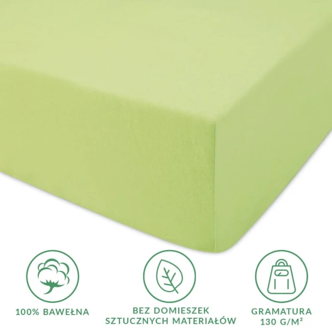 Prześcieradło jersey z gumką 180x200 w kolorze limonkowym. Złożone, z widoczną gładką fakturą materiału z 100% bawełny. Wyraźne symbole informujące o braku domieszek sztucznych materiałów oraz gramaturze 130 g/m². Ujęcie z boku na jednolitym tle.
