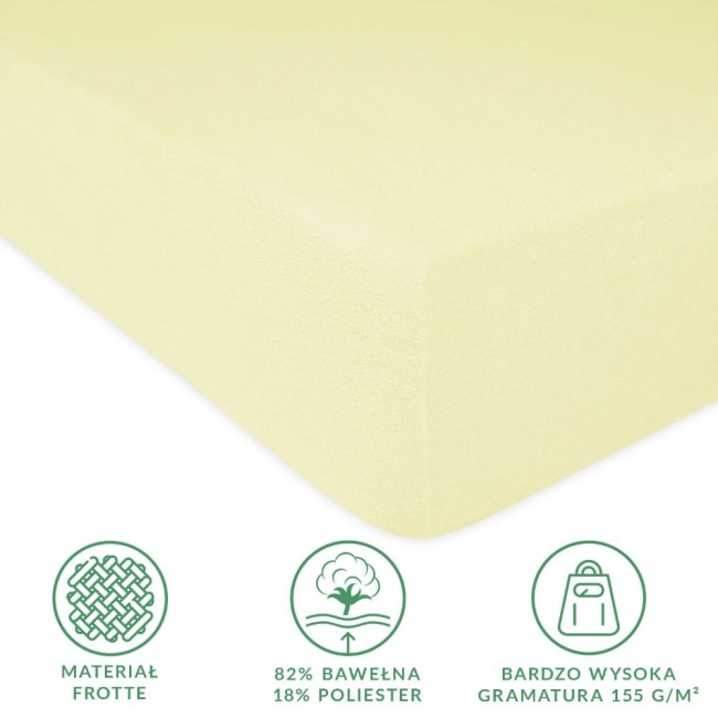 Prześcieradło frotte z gumką 90x200 w kolorze kremowym, z widoczną fakturą materiału. Ujęcie z boku, produkt leżący, z gładką powierzchnią. Widoczna informacja o składzie: 82% bawełna i 18% poliester, oraz wysoka gramatura 155 g/m².