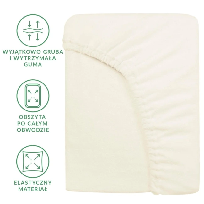 Prześcieradło frotte z gumką 120x200 w kolorze ecru, leżące na neutralnym tle. Widać elastyczny materiał oraz wyjątkowo grubą gumę obwodową. Zbliżenie na detale, takie jak obrzucenie krawędzi, które zapewnia stabilne mocowanie na materacu.