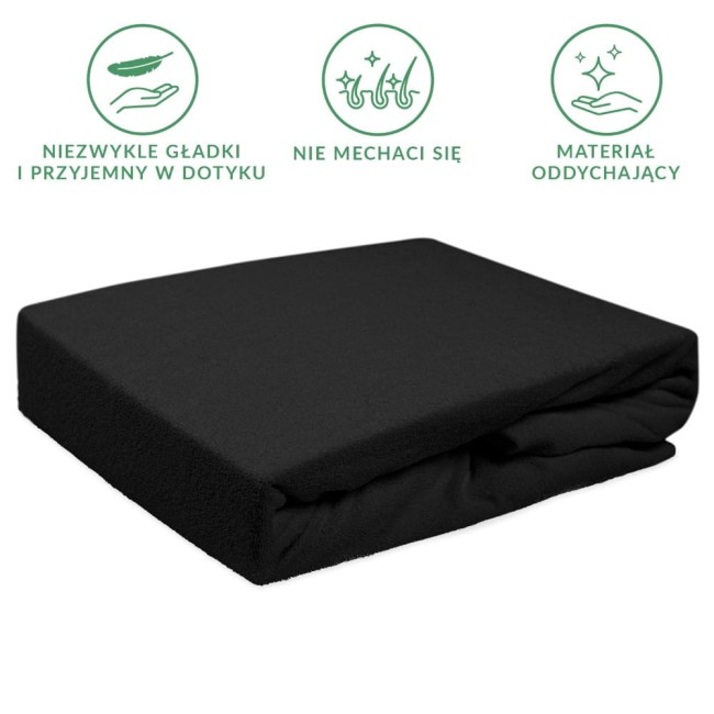 Prześcieradło frotte z gumką w kolorze czarnym, rozmiar 140x200 cm, leżące na gładkiej powierzchni. Materiał oddychający, przyjemny w dotyku, z wyraźnie widoczną teksturą. Brak zbędnych zdobień, zwarte ułożenie.