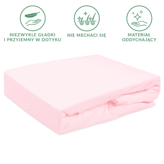 Prześcieradło frotte z gumką w kolorze róż kwarcowy, rozmiar 160x200 cm, leży na białym tle. Materiał jest gładki w dotyku, z widoczną gumką na bokach. Brak dodatkowych zdobień lub napisów na powierzchni.