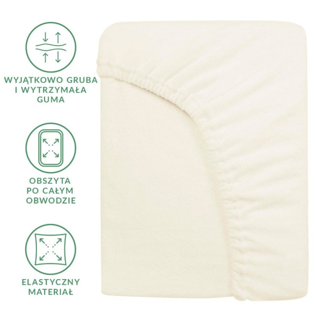 Prześcieradło frotte z gumką 180x200 w kolorze ecru, elastyczny materiał, z obszyciem po całym obwodzie. Ułożone na płasko, widoczny detal gumy, zdjęcie z boku. Tło jasne, proste, co podkreśla kolor i fakturę materiału.