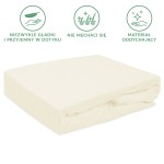 Prześcieradło frotte z gumką w kolorze ecru, w rozmiarze 180x200 cm, leżące na białym tle. Produkt prezentuje się w złożonej formie, ukazując gładką, teksturowaną fakturę materiału.