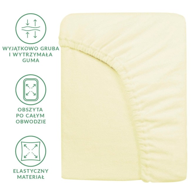 Prześcieradło frotte z gumką 180x200 w kolorze kremowym, leżące na gładkim tle. Widoczna elastyczna guma obszyta po całym obwodzie oraz gruba tkanina, podkreślająca wysoką jakość materiału. Idealne do łóżek o wymiarach 180x200 cm.