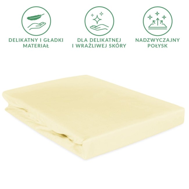 Prześcieradło satynowe z gumką w kolorze kremowym, wymiary 200x220 cm. Materiał gładki i delikatny, idealny dla wrażliwej skóry. Złożone, z widoczną gumką, która zapewnia stabilność na materacu.