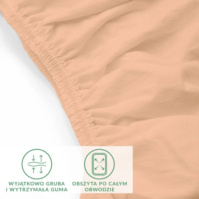 Prześcieradło jersey z elastanem w kolorze różowym, z gumką obszytą po całym obwodzie, leżące na białym tle. Zbliżenie na fakturę materiału oraz elastyczną, wytrzymałą gumę, które zapewniają idealne dopasowanie do materaca o wymiarach 90x200 cm.