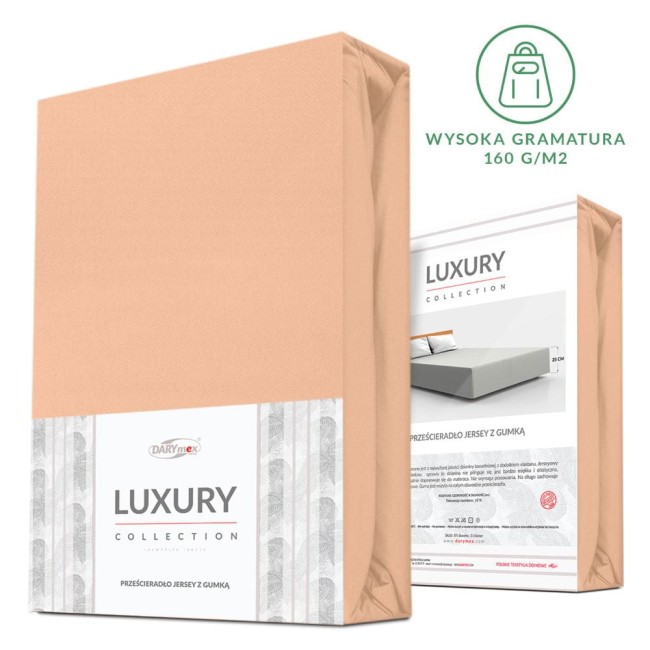 Różowe prześcieradło jersey z elastanem rozmiar 160x200, z gumką, leżące na białym tle. Widoczna etykieta z nazwą Luxury Collection oraz logo DARYmex. Opakowanie z detalami wykończenia oraz informacjami o produkcie na odwrocie.
