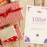 Karta podarunkowa o wartości 100 zł na jasnym tle. Widoczny duży napis „BON PODARUNKOWY” w kolorze fioletowym oraz logo „DARYmex” u góry.