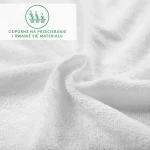 Prześcieradło frotte z gumką w kolorze białym, z widoczną teksturą materiału, przedstawione w zbliżeniu. Na tkaninie wyraźny detal splotu, ukazującym miękkość i grubość. Niezłożony, swobodnie leżący, idealne do łóżek o wymiarach 70x140.