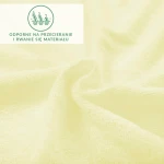 Prześcieradło frotte z gumką 70x140 w kolorze kremowym, leżące na płaskiej powierzchni. Wykonane z teksturowanego materiału, widoczne lekko falujące krawędzie. W rogu znajduje się widoczny napis o odporności na przecieranie. Tło jest jednolite i jasne.