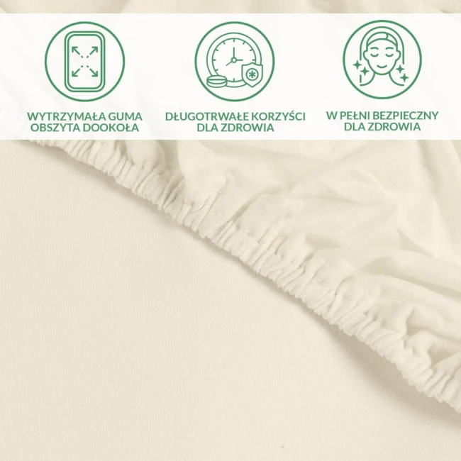 Ochronne prześcieradło z gumką 200x220 cm w kolorze kremowym, leżące na jednolitym tle. Widoczna wytrzymała guma obwodowa.