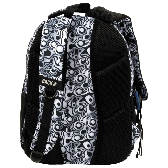 Plecak szkolny BackUp w czarno-białym wzorze, z dominującym żywym motywem w formie okręgów. Ujęcie z boku, pokazujące regulowane szelki i boczną siatkę wentylacyjną. Z przodu widoczne zakonserwowane logo BACKS. Wykonany z materiału syntetycznego.