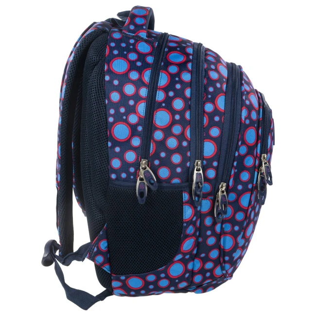 Plecak szkolny BackUp Kropki w kolorze granatowym z haftowanymi wzorami w czerwone i niebieskie kropki. Ujęcie z boku, ukazujące pięć zamków błyskawicznych oraz siatkowe wstawki. Produkt ma rączkę i regulowane szelki. Idealny dla dzieci.