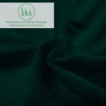 Prześcieradło frotte z gumką w kolorze zieleni butelkowej o gładkiej fakturze. Ułożone w złożony sposób, ukazujące miękkość materiału. Widoczne są oznaczenia dotyczące odporności na przecieranie i rwanie. Tło ciemne, co podkreśla głęboki kolor.