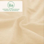 Prześcieradło frotte z gumką w kolorze jasnego beżu, z teksturą delikatnej dzianiny, ukazane w zbliżeniu. Widoczne składki materiału podkreślają jego miękkość i elastyczność, idealne do łóżka o wymiarach 140x200 cm.