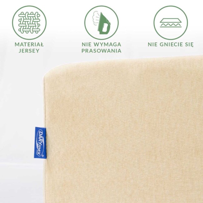 Prześcieradło jersey z gumką w kolorze jasnego beżu, o wymiarach 180x200 cm. Materiał jersey, nie wymaga prasowania, jest odporne na gniecenie. Widoczna etykieta producenta.