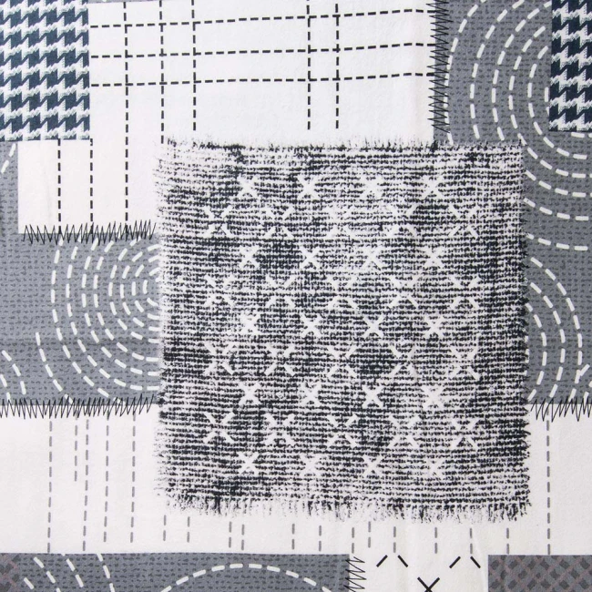 Pościel flanelowa 180x200 Ardela Grey w kolorze szaro-białym, z różnorodnymi wzorami: kratką, liniami i okręgami. Materiał miękki, z teksturą flaneli. Zdjęcie ukazuje fragment materiału z bliska, akcentując detale splotu oraz kolory.