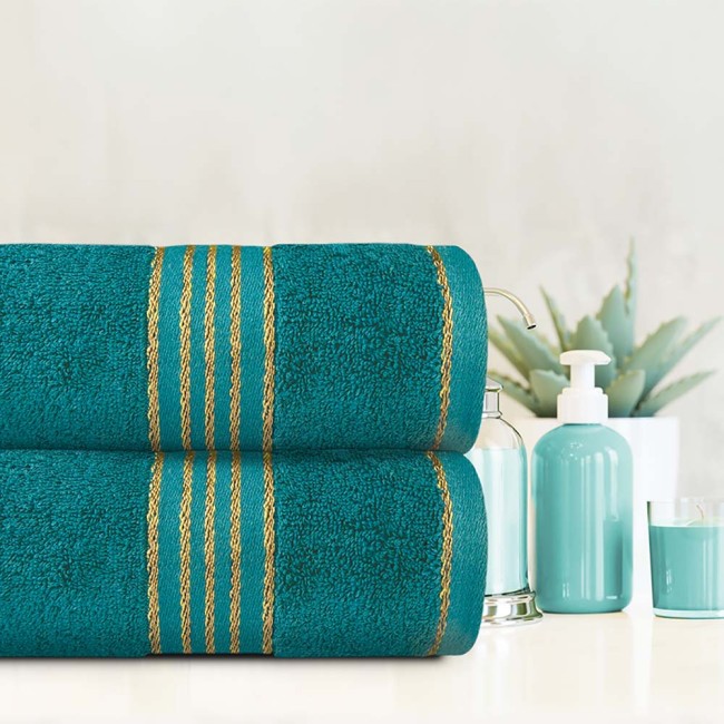 Komplet ręczników z bawełny w eco pudełku kolor ciemny turkus z bordiurą w złote paski 500 g/m2 TIWANO 2 kpl.
