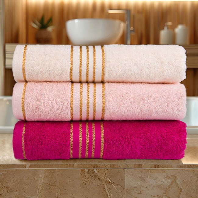 Komplet ręczników z bawełny w eco pudełku kolor jasno różowy z bordiurą w złote paski 500 g/m2 TIWANO 3 kpl.