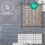 Flanelowa pościel w kolorze szarym, z unikalnym wzorem składającym się z różnych geometrycznych elementów, w tym kraty oraz okręgów. Materiał ma delikatną teksturę. Widoczne hafty w różnych odcieniach szarości i beżu, w zbliżeniu na szczegóły.