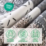 Pościel flanelowa 180x200 Ardela Grey w kratkę szaro-biało-czarną, ułożona na płasko, ukazująca różne wzory i tekstury materiału. Widoczne detale to czarno-białe wzory oraz miękka, lekko puszysta faktura flaneli.