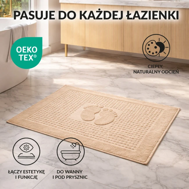 Dywanik łazienkowy 50x70 cm w kolorze cappuccino, z wytłoczonym wzorem stóp. Ułożony na jasnym podłożu, teksturowany, idealny do wanny i pod prysznic. Oeko-Tex, łączący estetykę i funkcję.