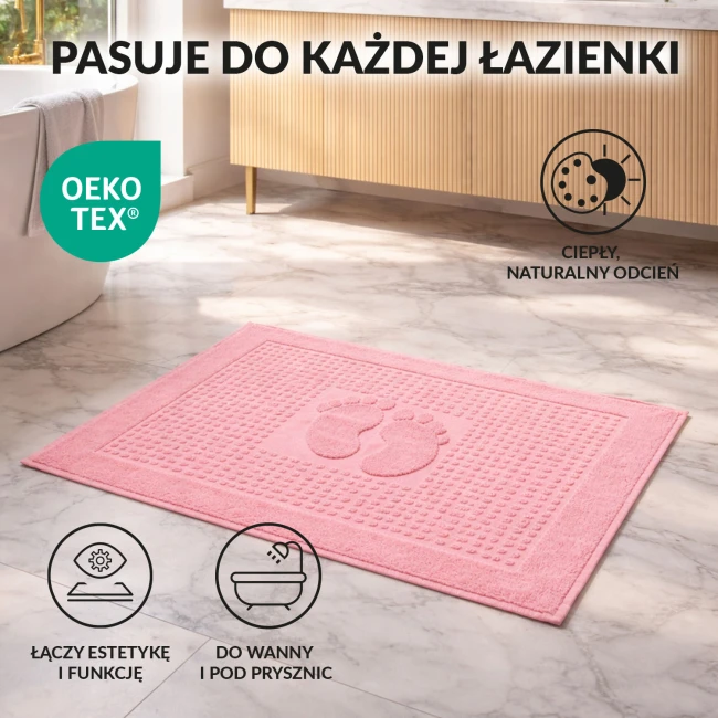 Dywanik łazienkowy 50x70 cm w kolorze ciemnego różu z wytłoczonym wzorem stópek. Produkt o teksturowanej powierzchni, leżący na jasnym tle, idealny do wanny lub pod prysznic, łączący estetykę z funkcjonalnością.