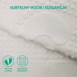 Dywanik łazienkowy 50x70 cm w kolorze białym, z teksturą w formie wypukłych kropek i wzorem stopy. Ułożony na jedwabistym tle, pokazuje detale tkaniny oraz fakturę tworzywa. Produkt leży płasko, ukazując jego funkcjonalność oraz estetyczne wykończenie.
