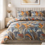 Pościel satynowa 140x200 w tropikalne liście na szarym tle, ułożona na łóżku. Widoczne dwie poszewki na poduszki oraz prześcieradło z żywymi kolorami liści w odcieniach pomarańczowym, niebieskim i zielonym.