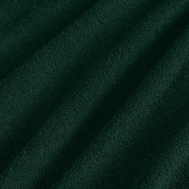 Pościel frotte 135x200 w kolorze butelkowej zieleni, wykonana z miękkiego materiału o teksturowanej powierzchni. Widoczne fałdy tkaniny, podkreślające jej gęstość i przyjemność w dotyku.