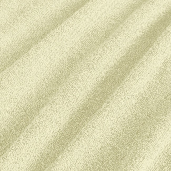 Pościel frotte 135x200 w kolorze kremowym, wykonana z miękkiego materiału o teksturowanej powierzchni. Widoczne są delikatne wzory i struktura tkaniny, co podkreśla jej komfort oraz estetykę. Produkt leży na płaskiej powierzchni.