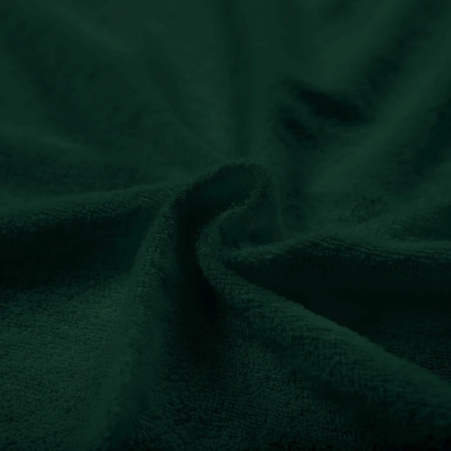 Pościel frotte 200x220 cm w kolorze butelkowej zieleni, z dwiema poszewkami 80x80 cm. Materiał o teksturze frotte, ukazujący miękką i przyjemną w dotyku powierzchnię, złożony w delikatne fale.