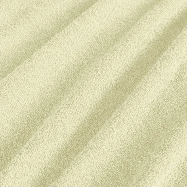 Poszewka frotte 40x80 w kolorze kremowym, wykonana z miękkiego materiału o teksturze pętelkowej. Widoczne drobne włókna, które zapewniają wygodę i przyjemność w dotyku. Produkt leży na płaskiej powierzchni.