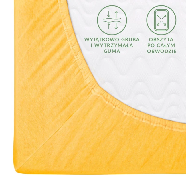 Prześcieradło jersey z gumką w kolorze żółtym o wymiarach 80x160. Produkt leży na płaskiej powierzchni, ukazując wytrzymałą gumkę oraz teksturę cienkiego materiału. Widoczne napisy dotyczące cech produktu są czytelne, a tło jest jasne.